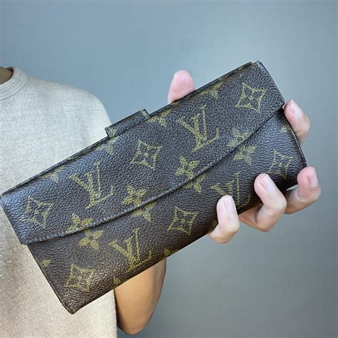 lv pouch wallet|louis vuitton checkbook wallet.